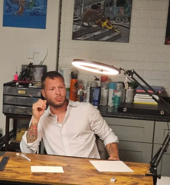 Zechariah in the studio at his desk